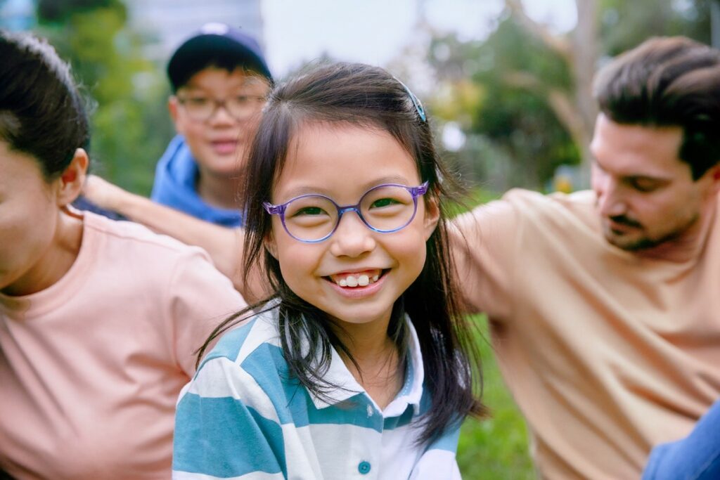 SightGlass Vision image 2 asian girl wearing glasses with her family